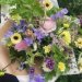 A bouquet of seasonal, pastel, locally grown flowers.