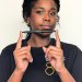 Student holding branded pen