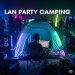 A person camping in the middle of a LAN party