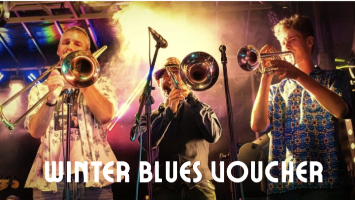 3 brass players on stage at an exciting gig