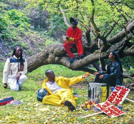 Young Africans in bright leisurewear sitting by a tree