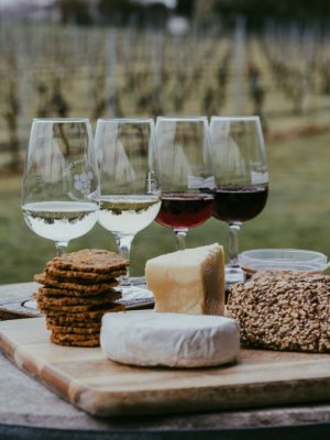 A cheeseboard and some glasses of wine