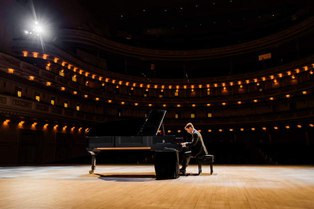 Vladimir Rumyantsev at the piano on the stage of Carnegie Hall