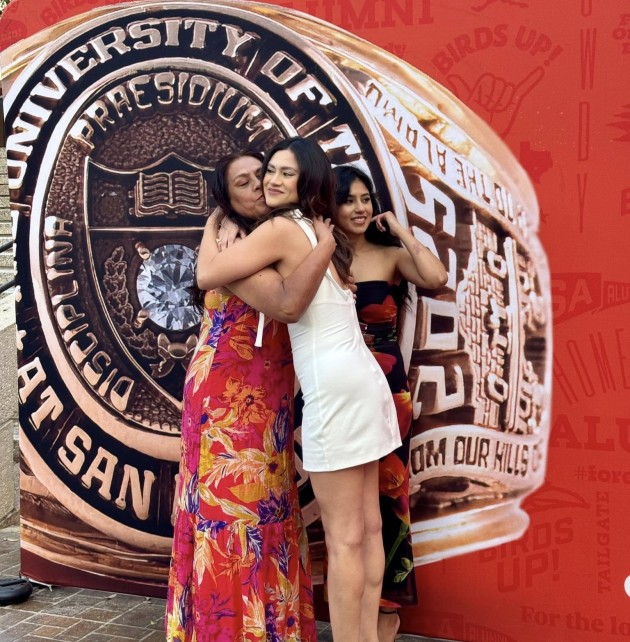 ring recipient and family hugging