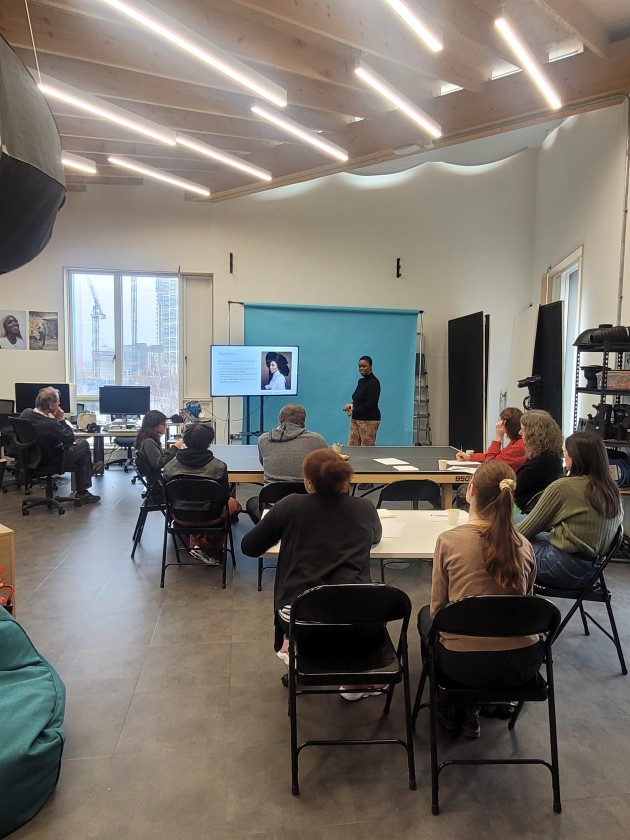 The Photography Foundation Studio space with photography equipment, workshop tables, chairs, and participants.