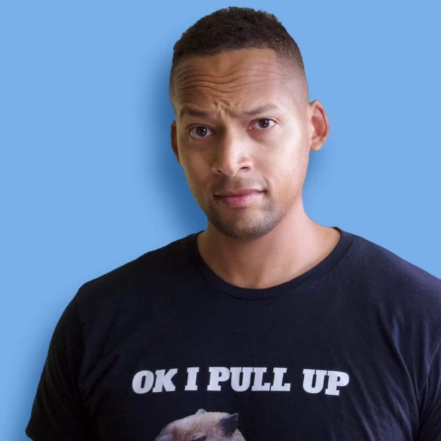 Quentin Davis performing stand-up comedy at a live comedy show in Saratoga Springs