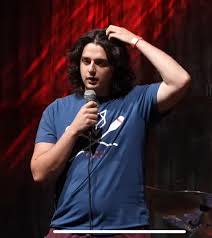This image contains comedian Jovan Afzali.  He will be performing comedy at Artisanal Brew Works Saturday July 11th at 8PM.