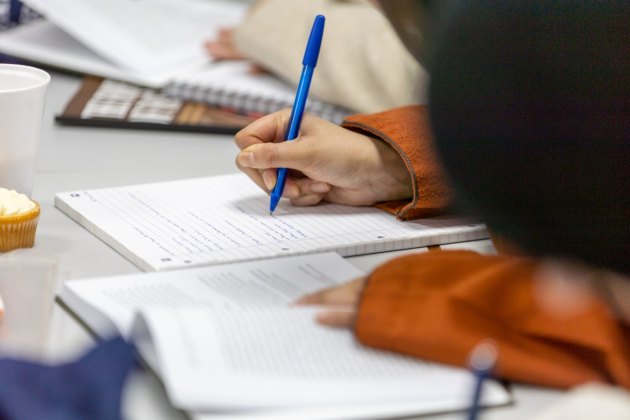 A student taking notes during a BMC class