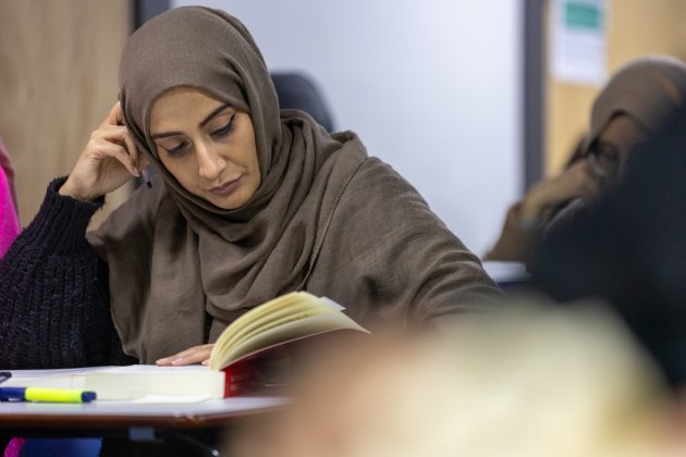 Students reading and studying in a BMC classroom