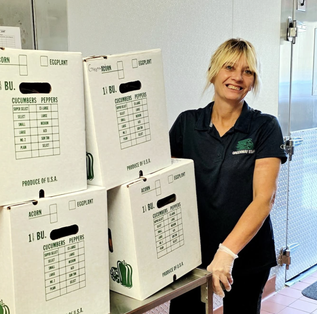 Kitchen Staff taking delivery of local foods