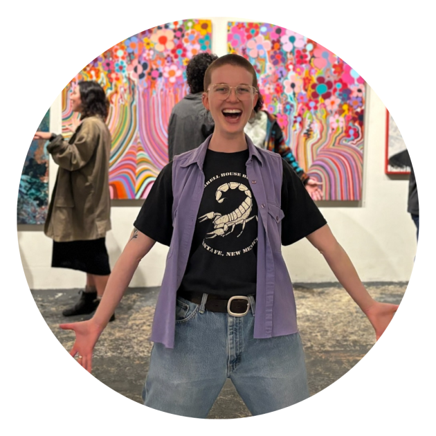 Jesse standing happily in a bold and ecstatic dance pose.