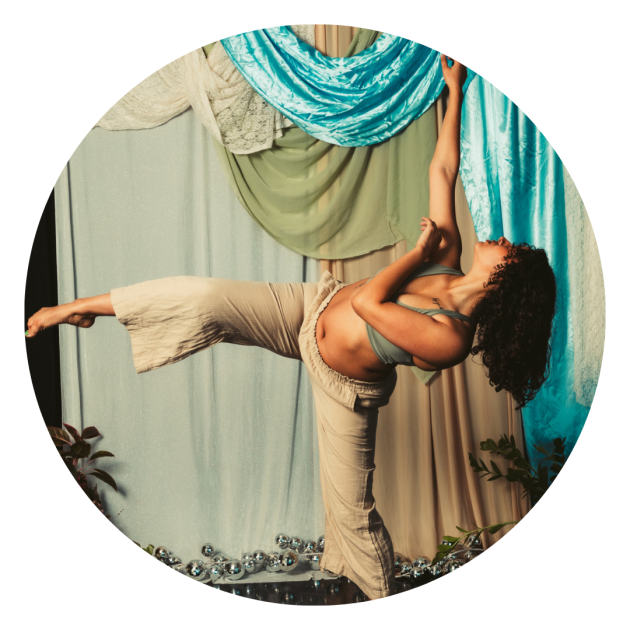 Dancing photo of Ilyana with and arm and leg outstretched.