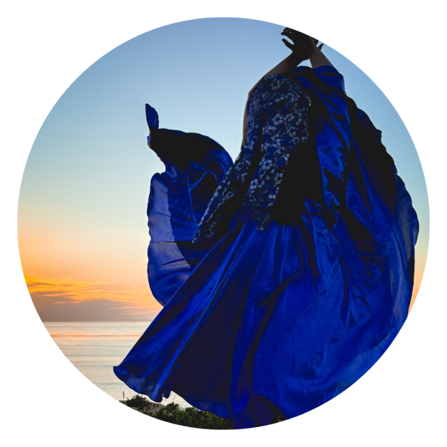 Dancing photo of Azul in a bright blue dress.