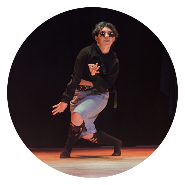 Dancing photo of Cameron wearing black star glasses.